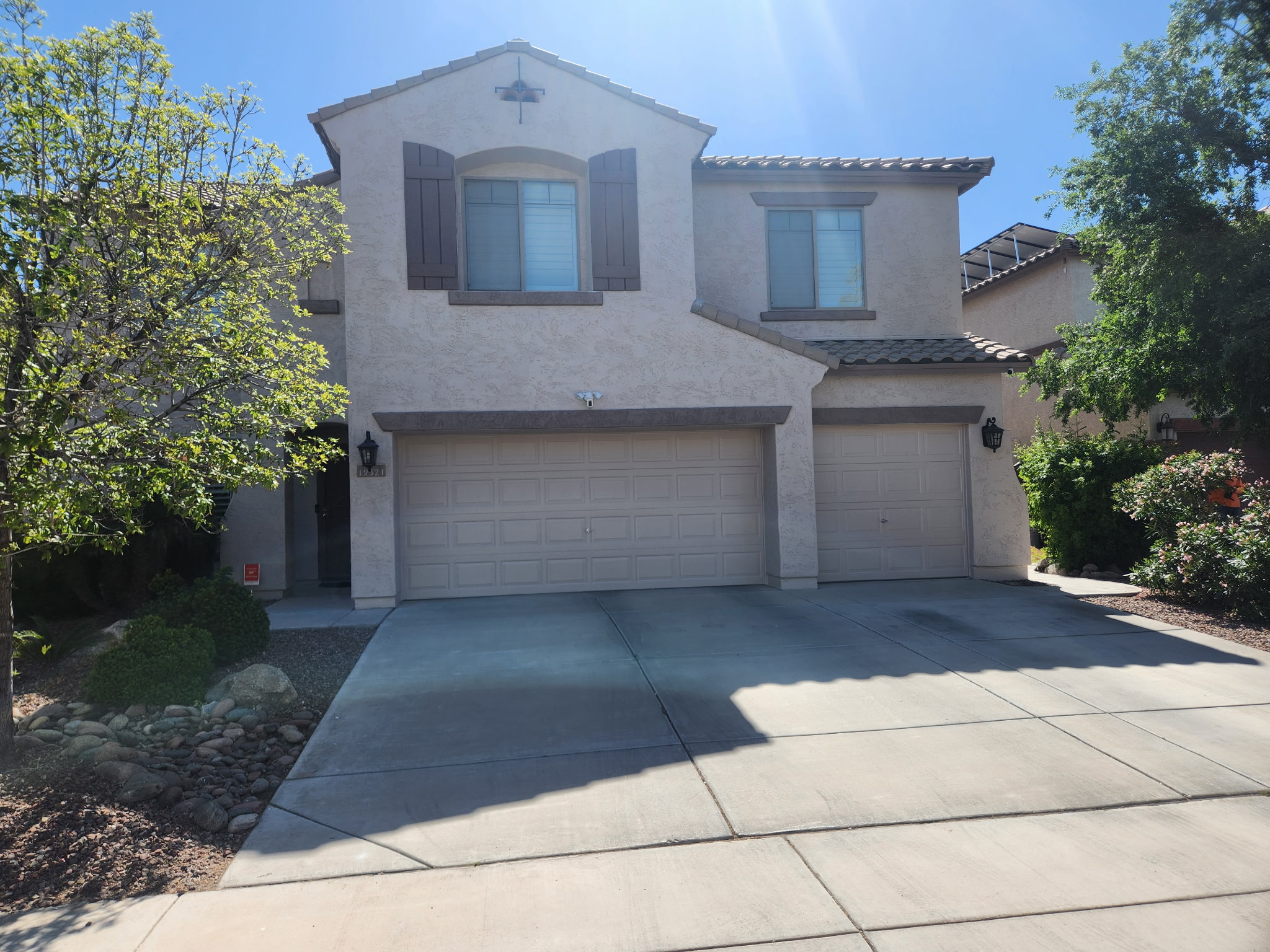 Home exterior after repaint, bright daylight - painting company Maricopa Arizona