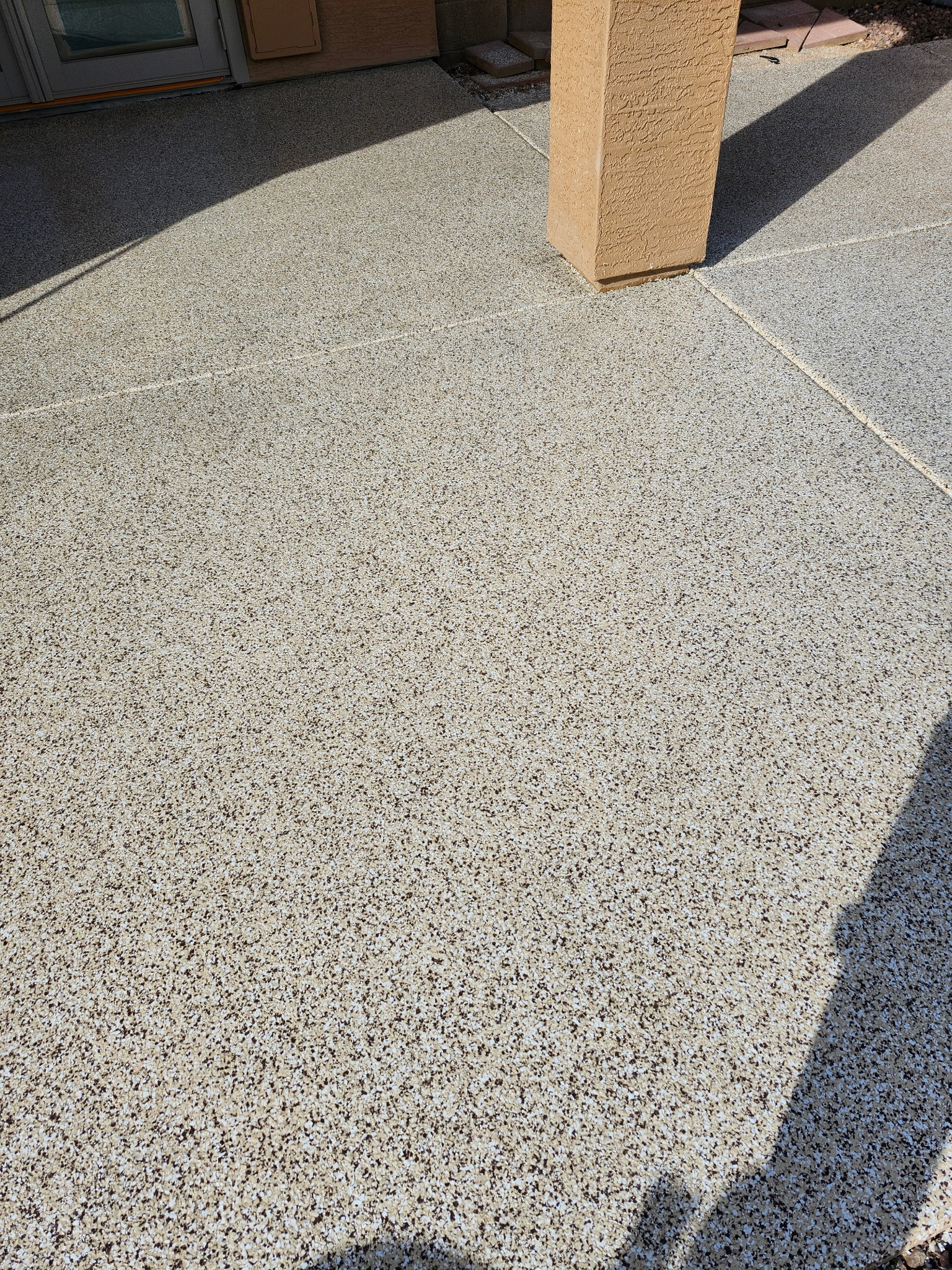 Concrete patio slab after flake floor coating